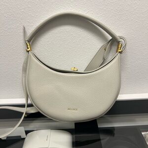 Elegant White Shoulder Bag with Gold Details